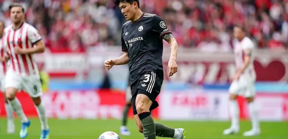 Player dribbling ball during soccer match