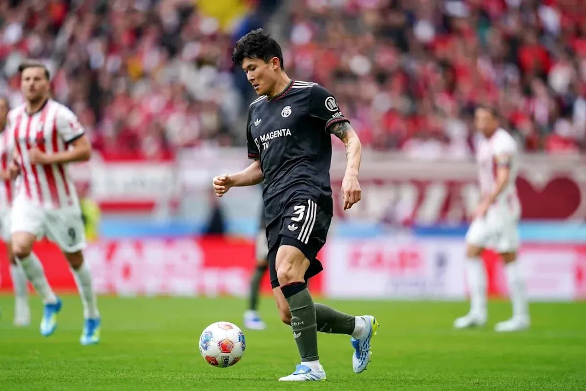 Player dribbling ball during soccer match