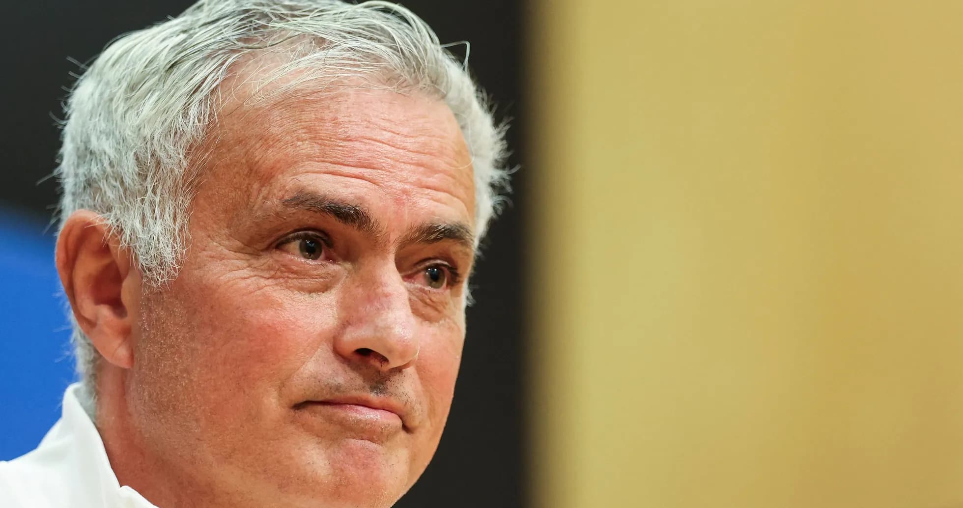 Manager speaking during press conference with serious expression