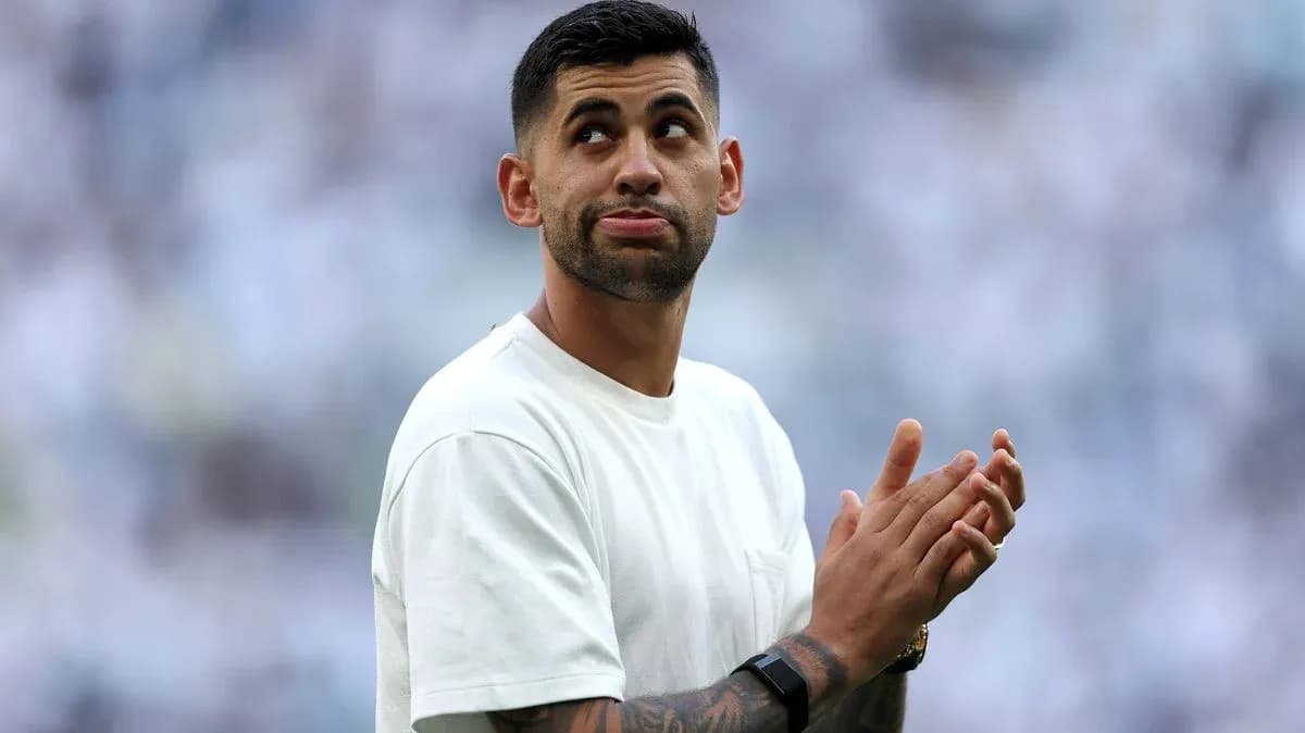 Player applauding in a stadium with fans
