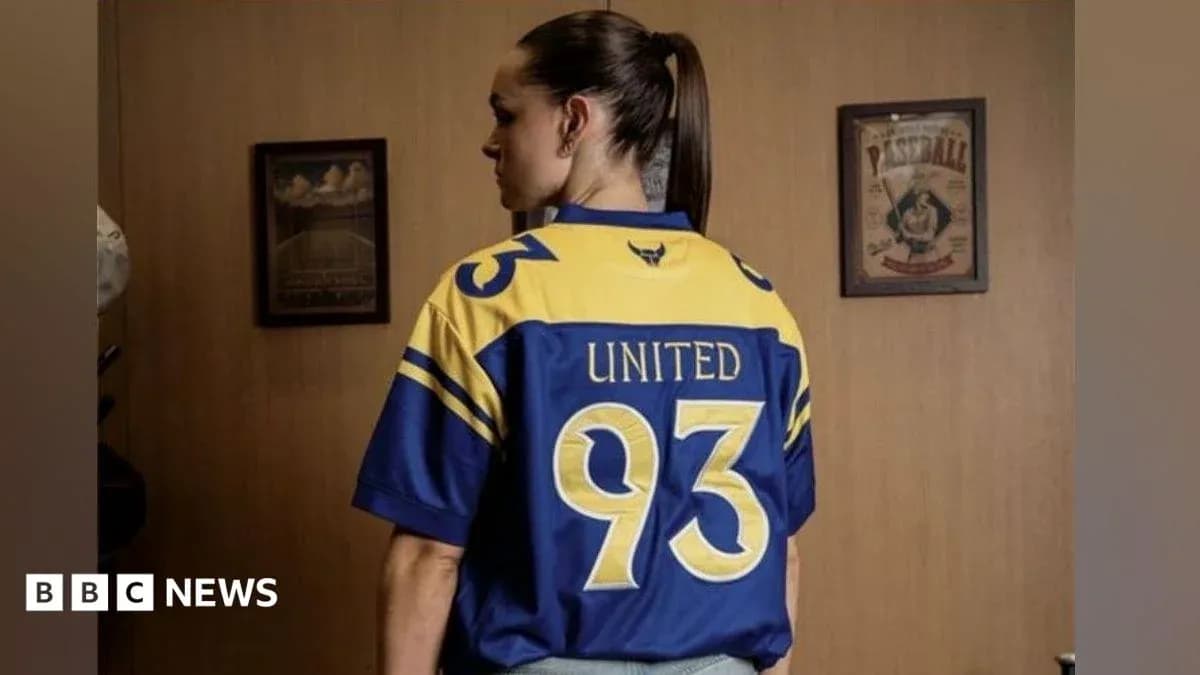 Person wearing a blue and yellow jersey with 'United 93'