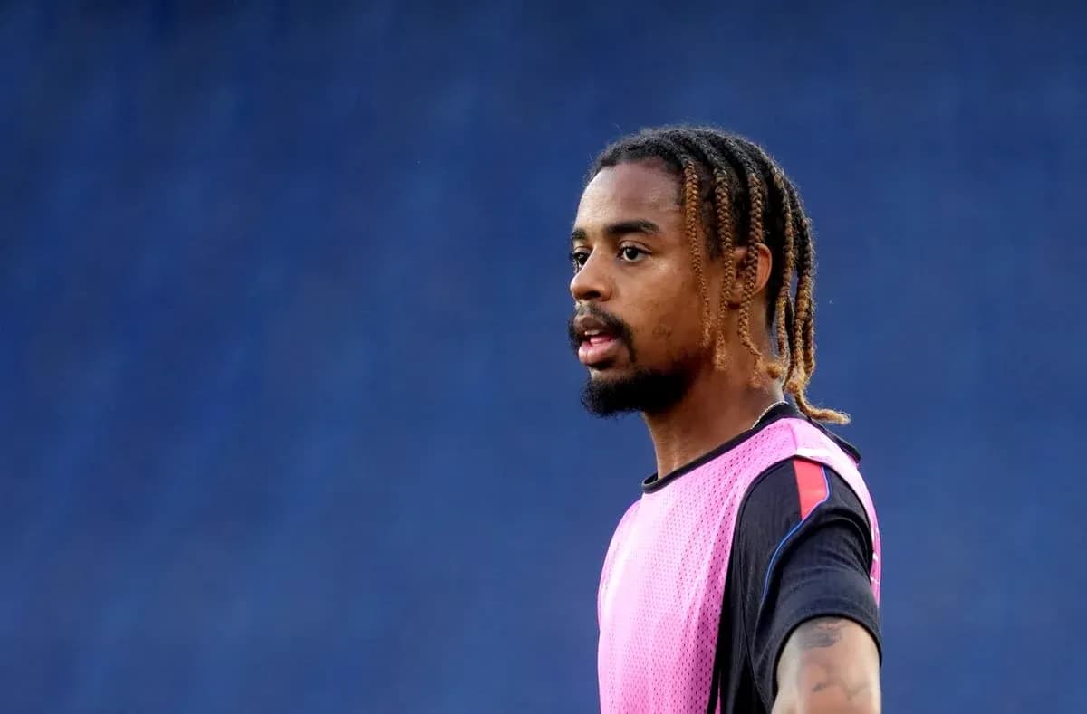 Player in pink training vest during practice session