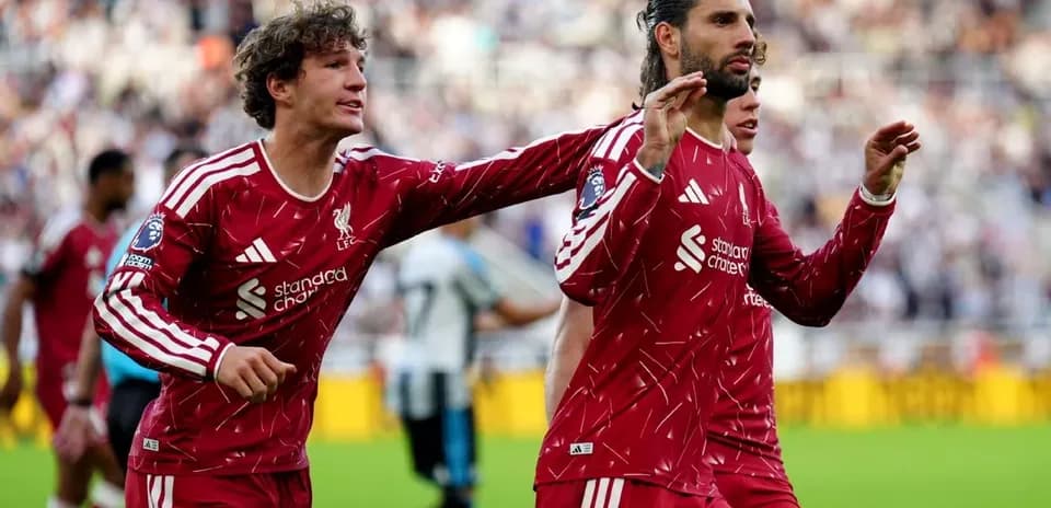Liverpool players celebrating a goal during match