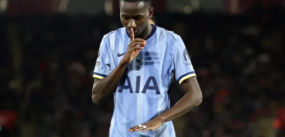 Player gesturing with finger to lips during match