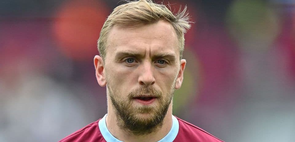 Player with short hair in maroon jersey