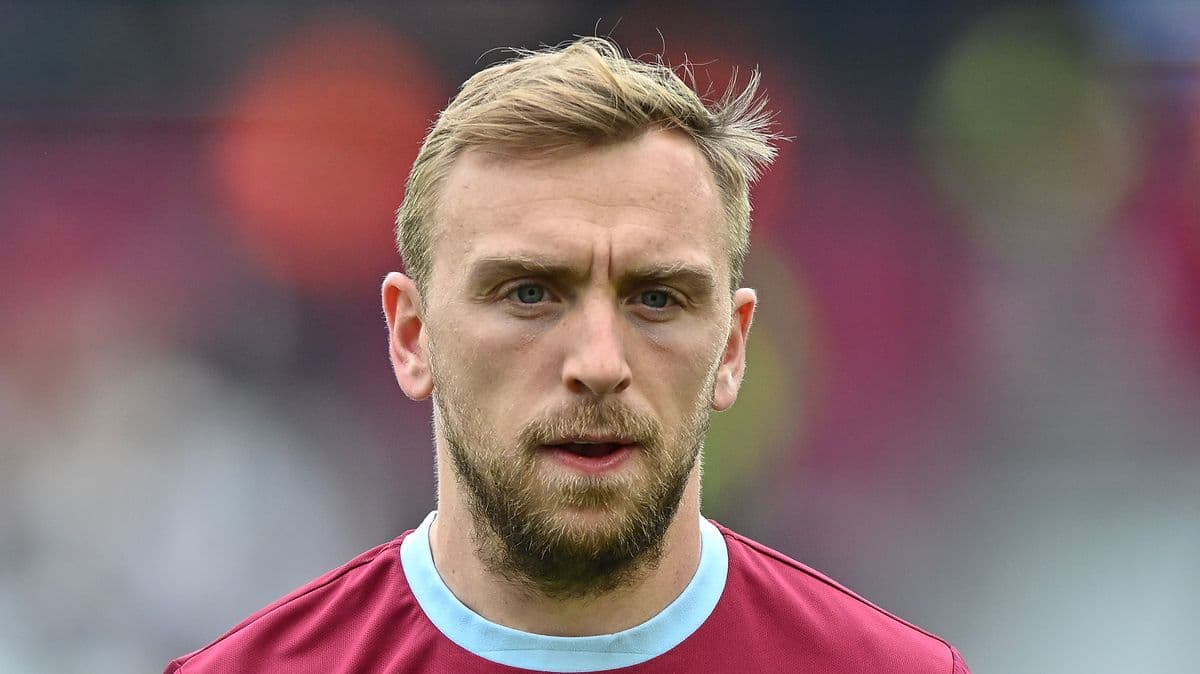 Player with short hair in maroon jersey