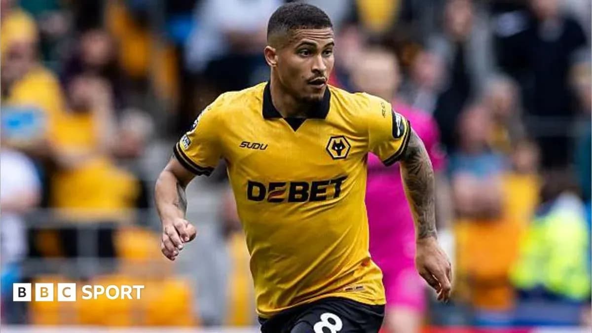 Player running in yellow Wolves jersey during match