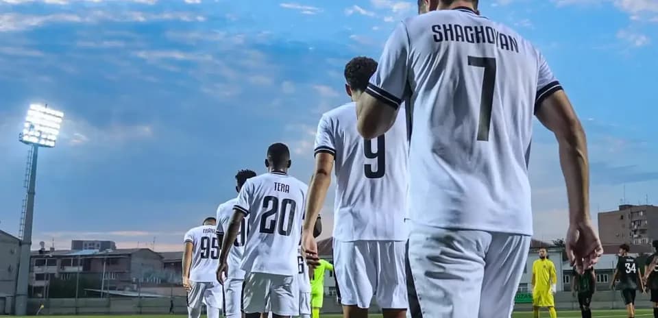 Players walking onto the field for match