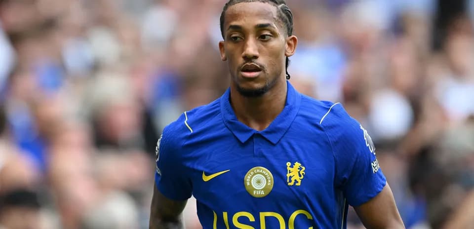 Player wearing blue Chelsea jersey on the field