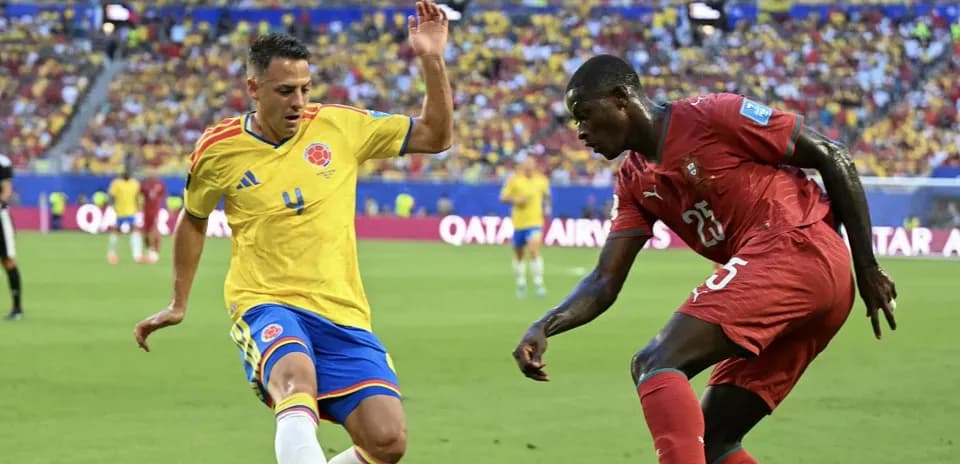 Two players contesting the ball during match action