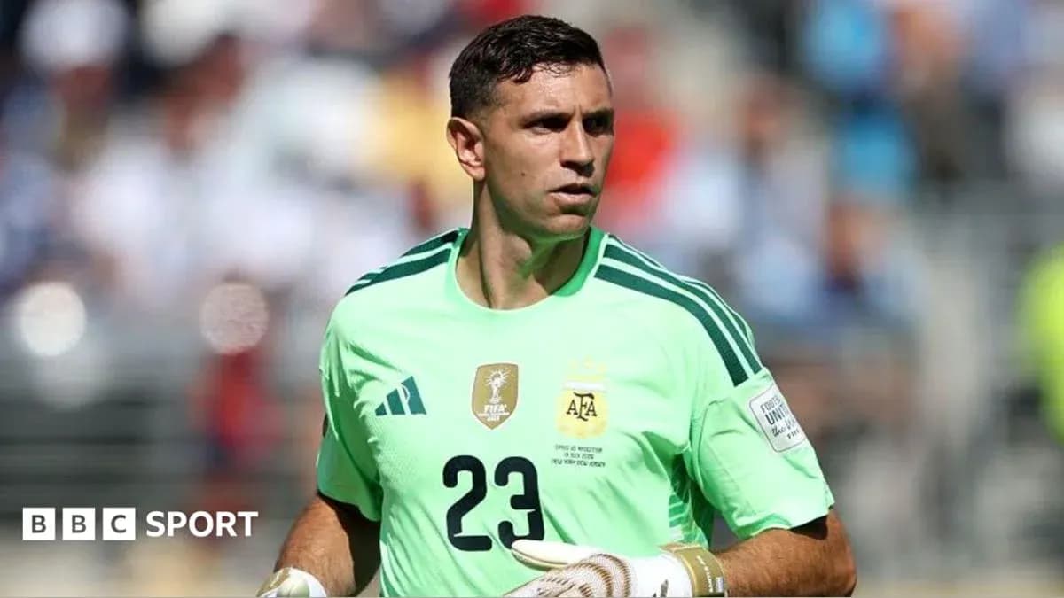 Goalkeeper in green jersey during match warm-up