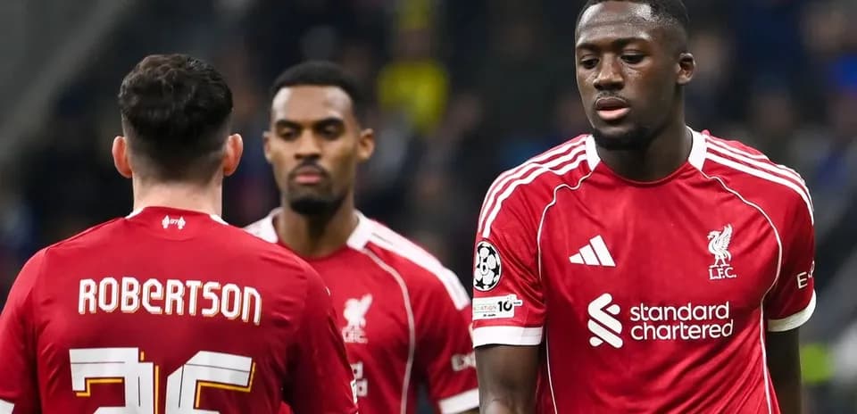 Liverpool players walking on the pitch during match