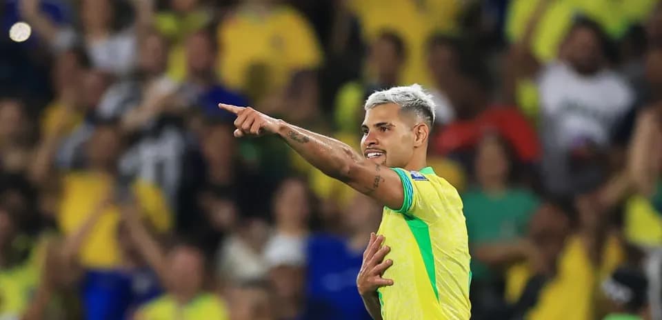 Player celebrating and pointing to fans in stadium