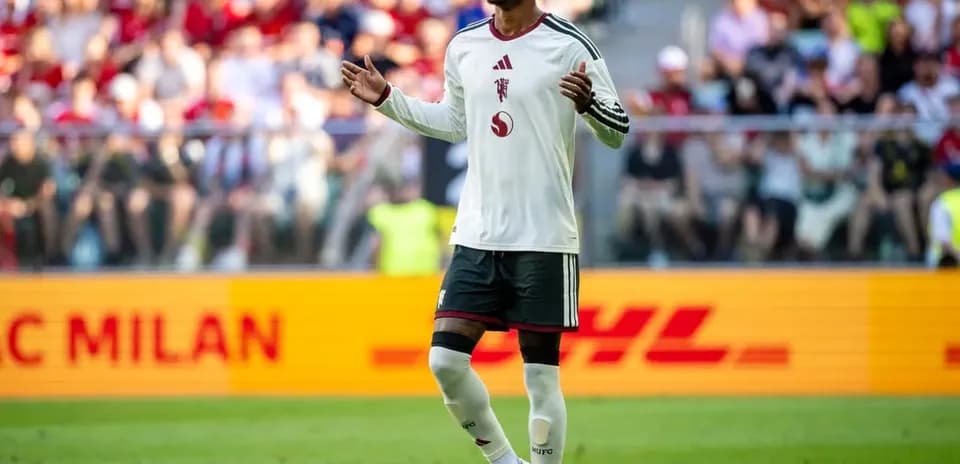 Player gesturing during match with spectators in background