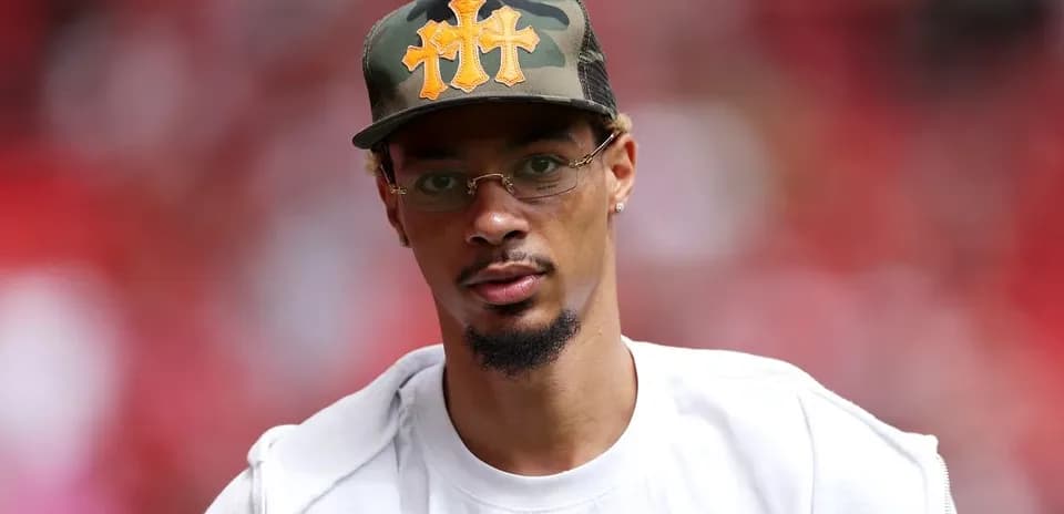 Person wearing a camo hat and glasses