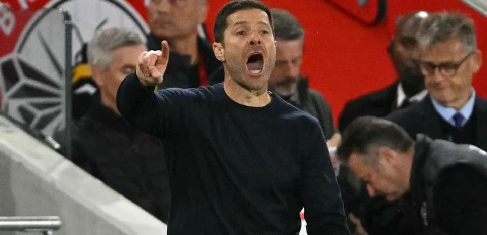 Coach gesturing and shouting from the sidelines