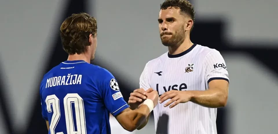 Players shaking hands during UEFA match