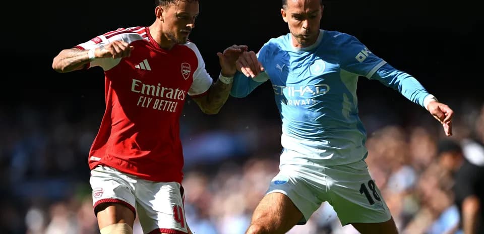 Two players challenging for the ball during match