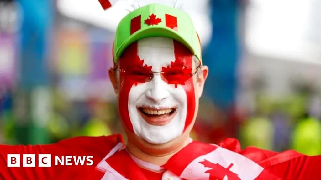Fan celebrating with Canadian flag face paint