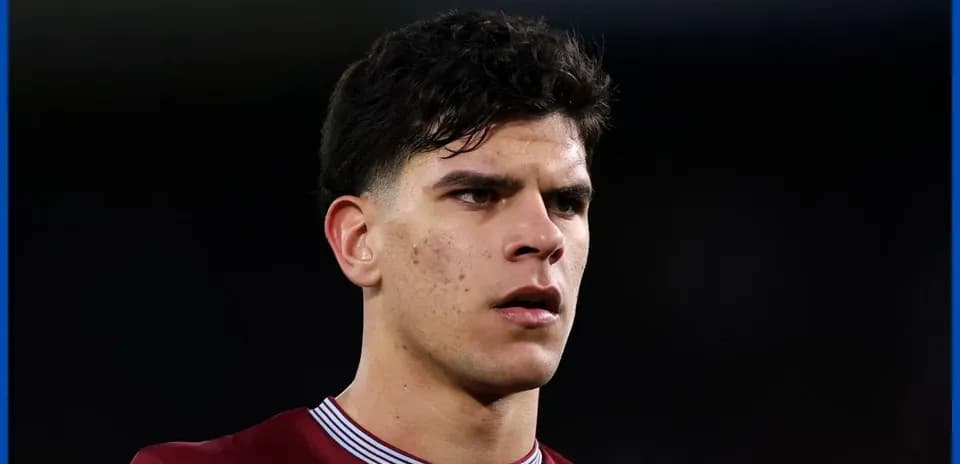 Football player in maroon jersey during match