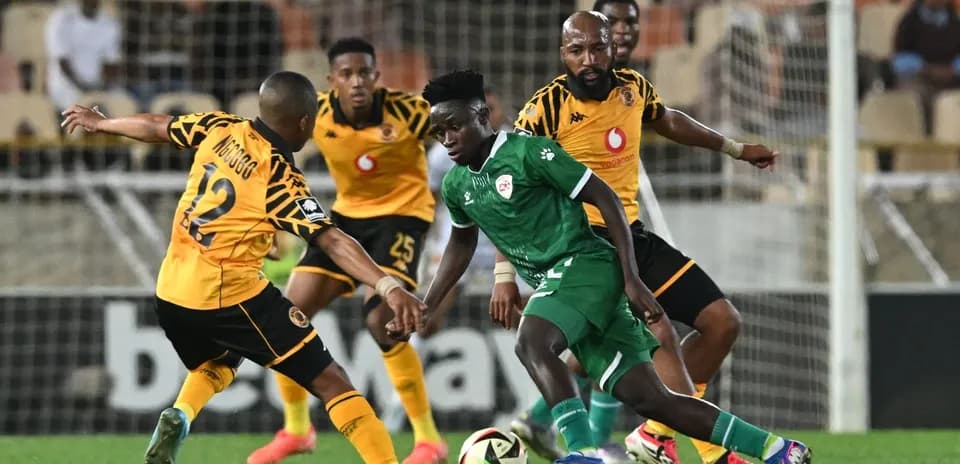 Players competing for the ball during a football match
