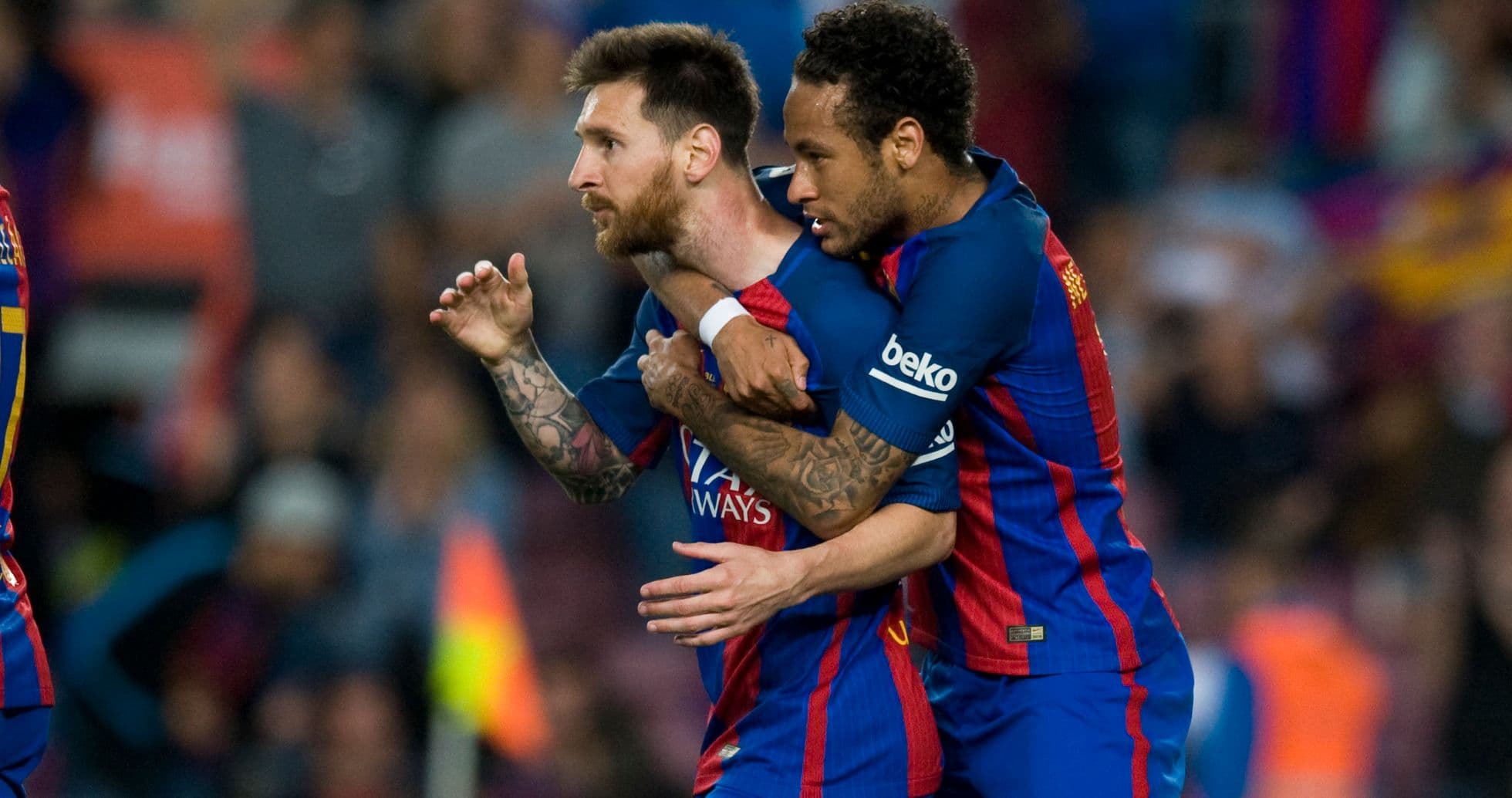 Lionel Messi celebrating with Neymar after a goal