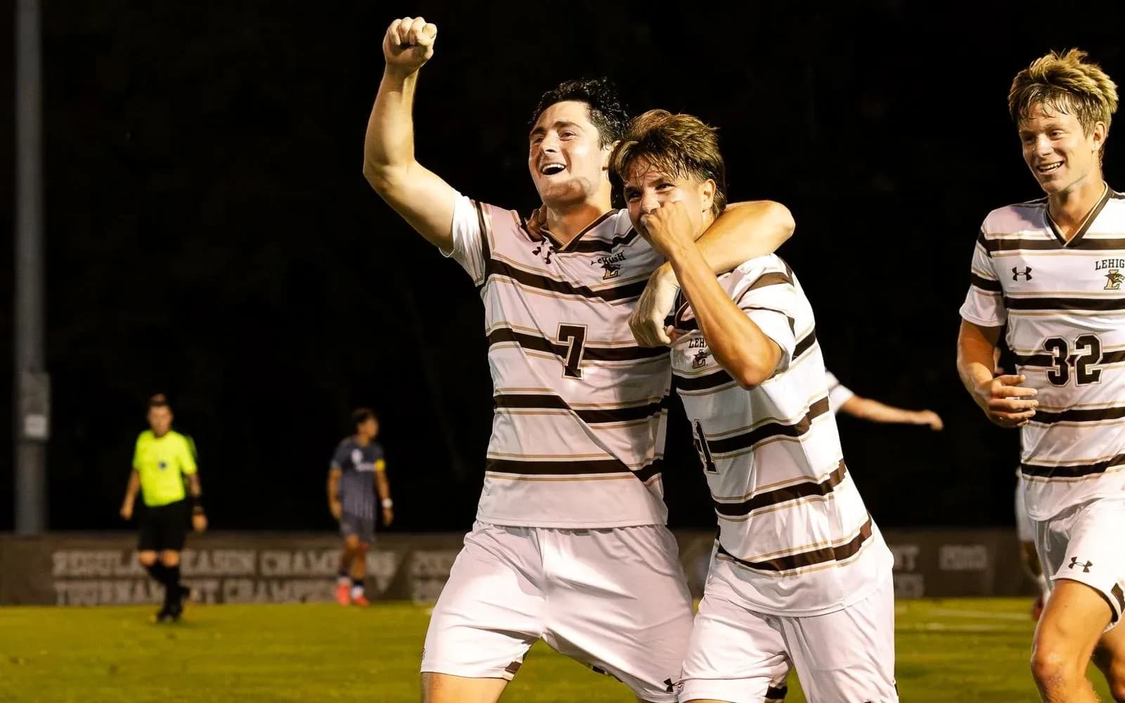 Players celebrating a goal during a soccer match
