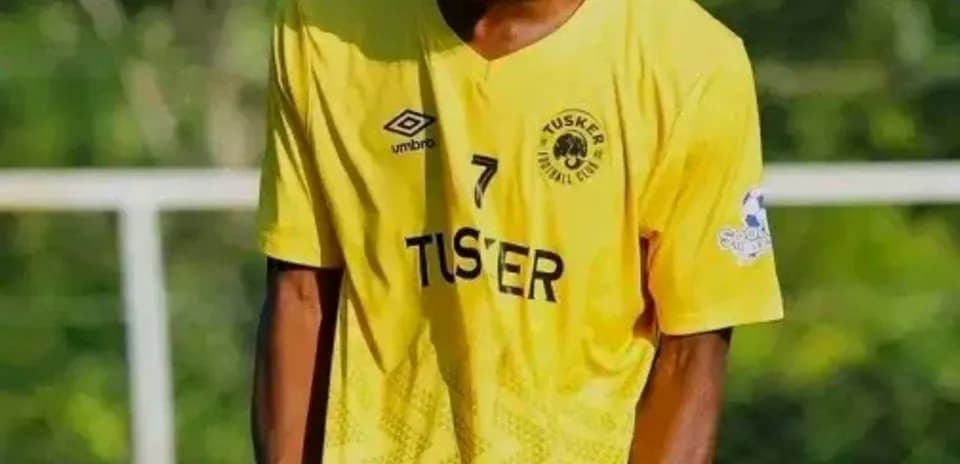 Player celebrating in yellow team jersey on field