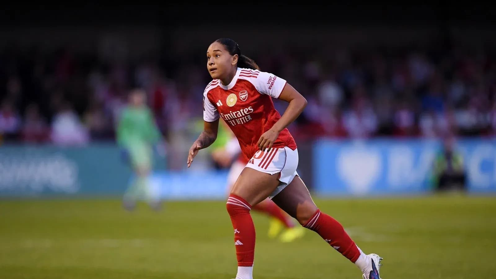Player running during women's football match