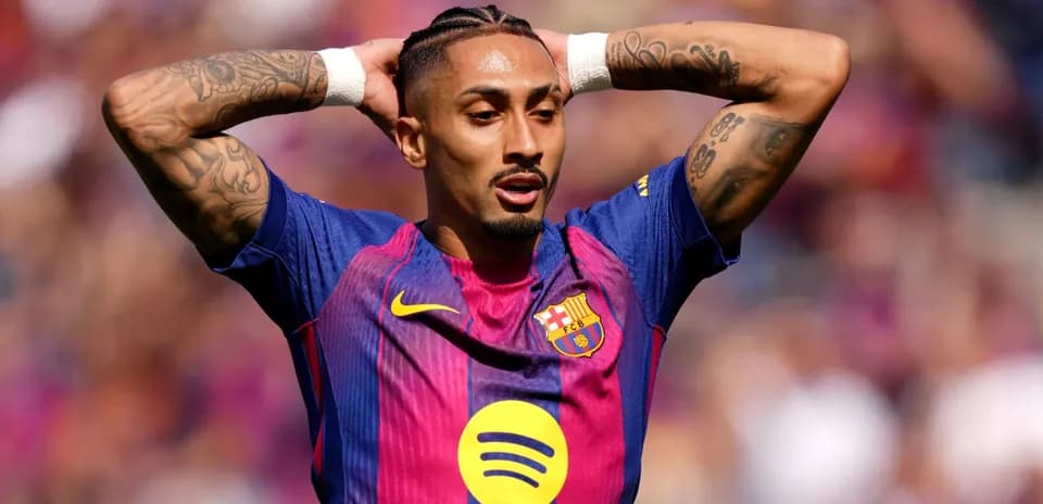 Player with tattoos expressing frustration on field