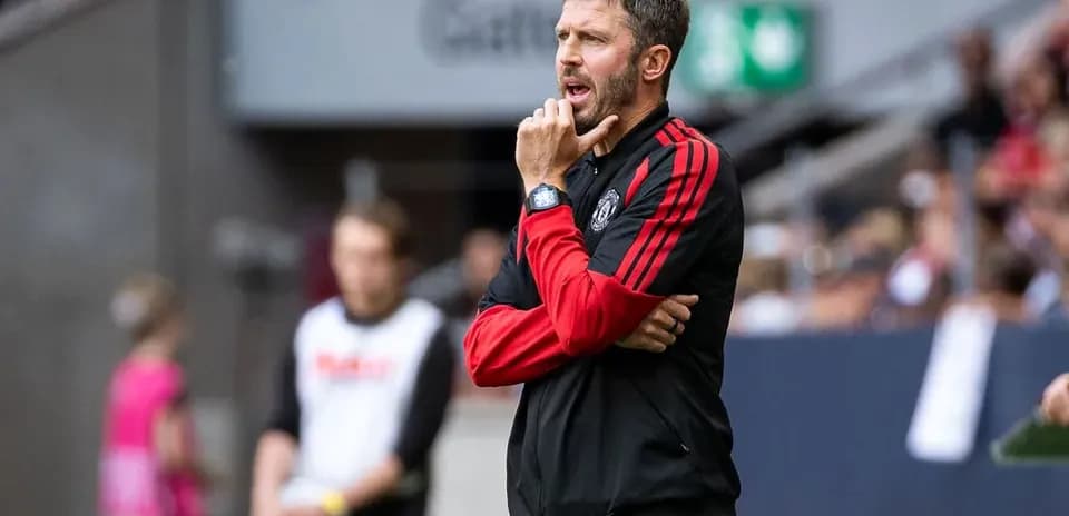 Coach observing match from sidelines during game