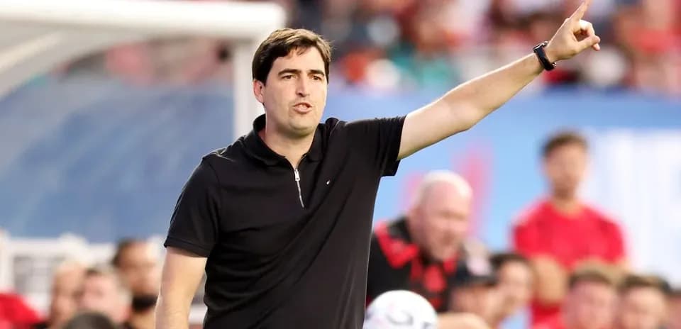 Coach giving instructions from the sidelines during match