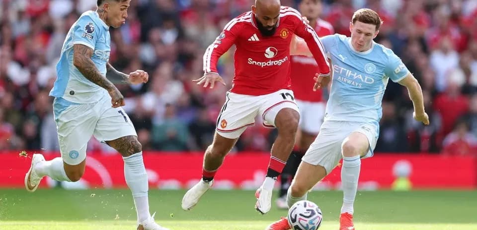 Three players competing for the ball during match