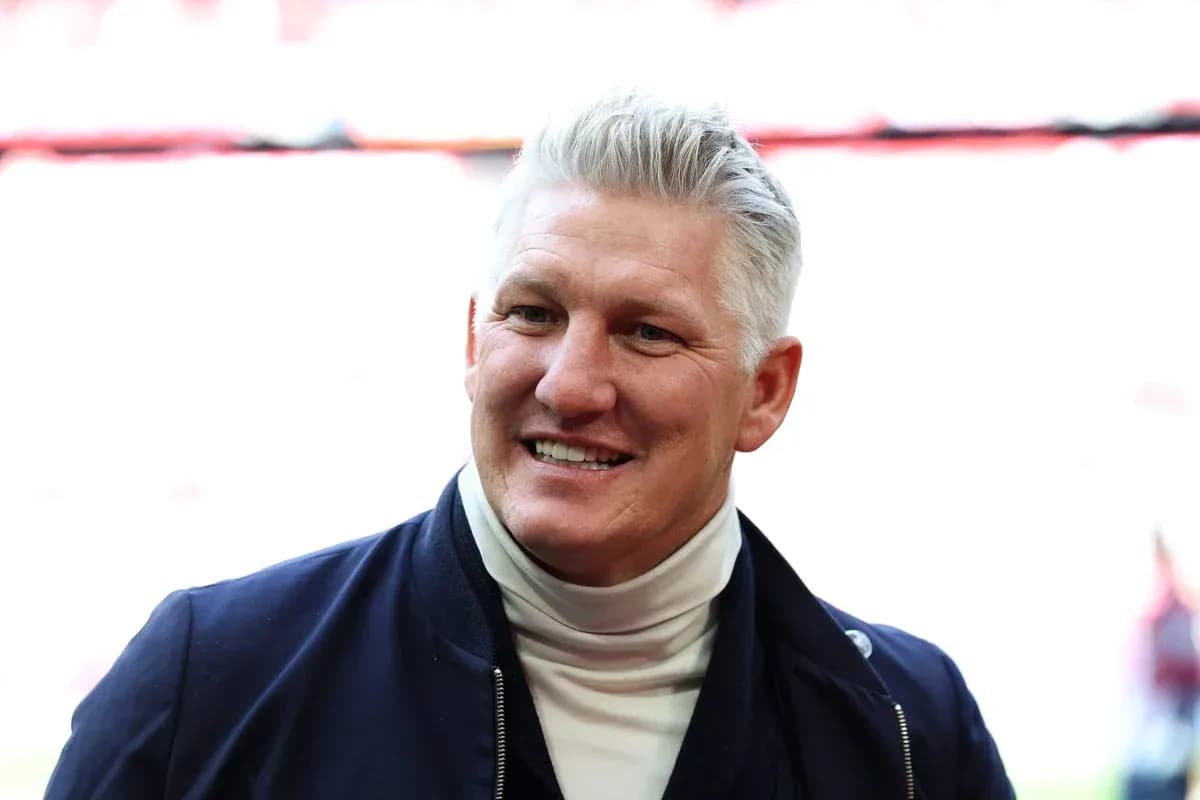 Man smiling in a dark jacket and turtleneck