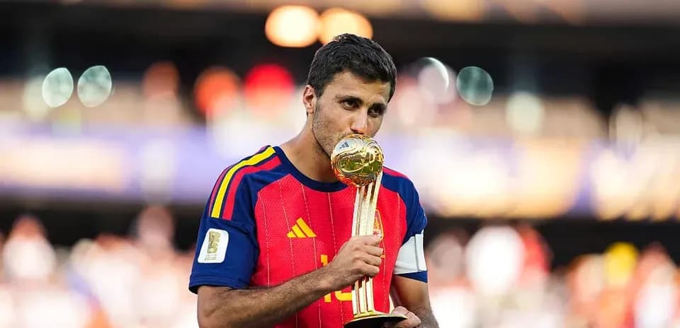 Player holding and kissing trophy after victory