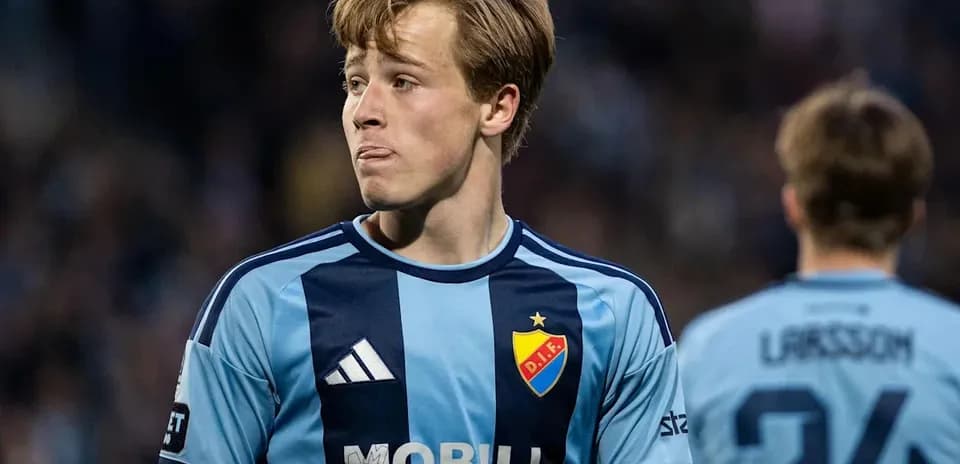 Player wearing blue jersey during match action