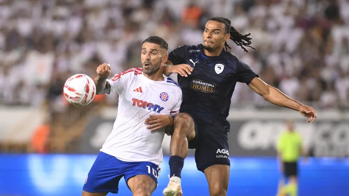 Pafos player challenging HNK Hajduk Split player