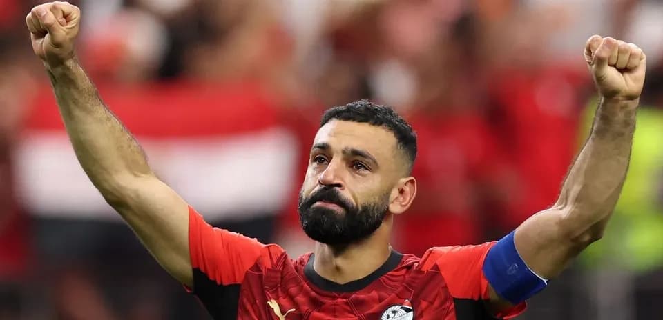 Player celebrating with raised fist in stadium