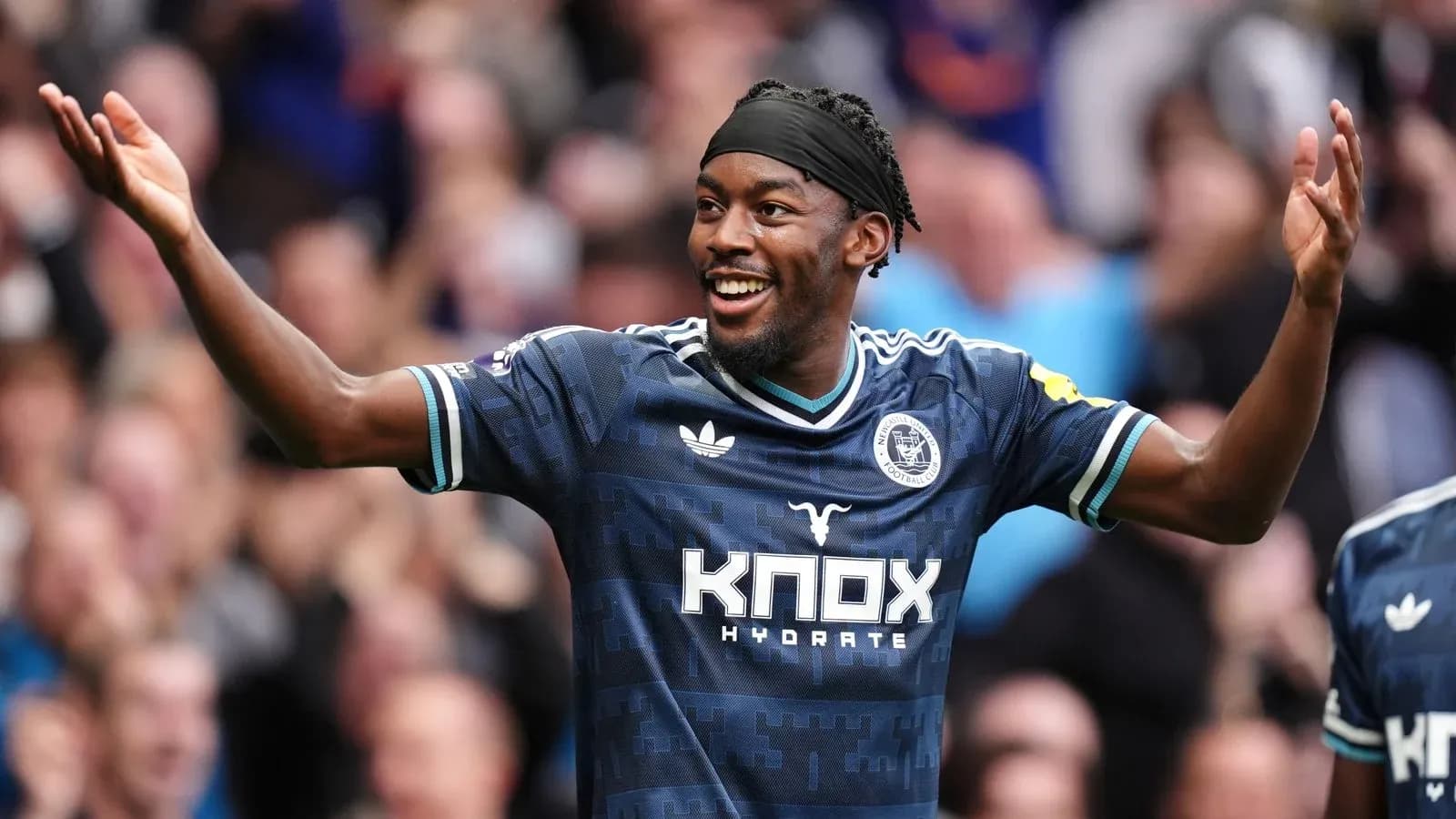 Player celebrating a goal with outstretched arms