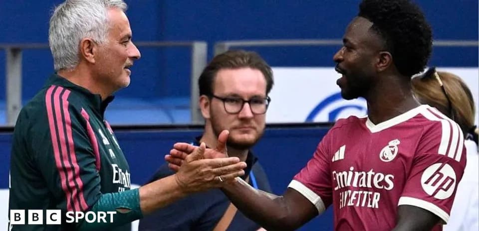 Coach and player shaking hands during match