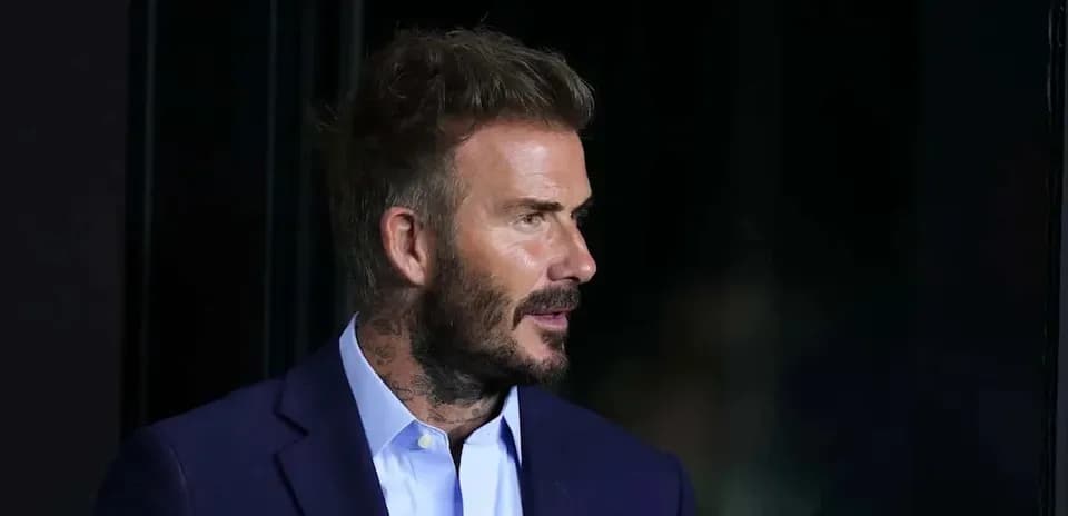 Man in suit speaking at an event