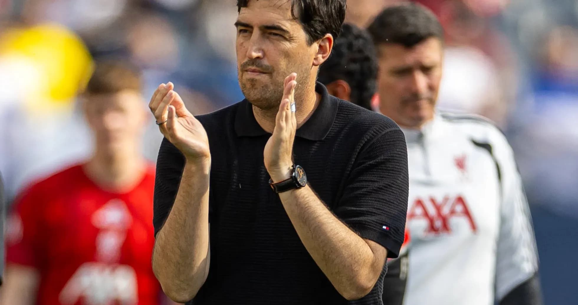 Coach applauding players after a match
