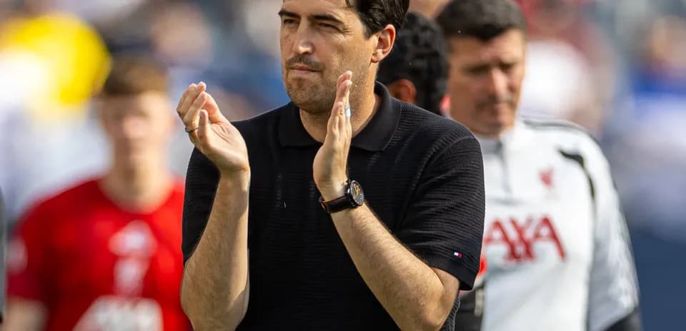 Coach applauding players after a match