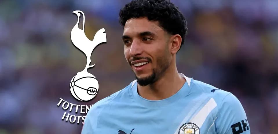 Player in Manchester City kit smiling during match