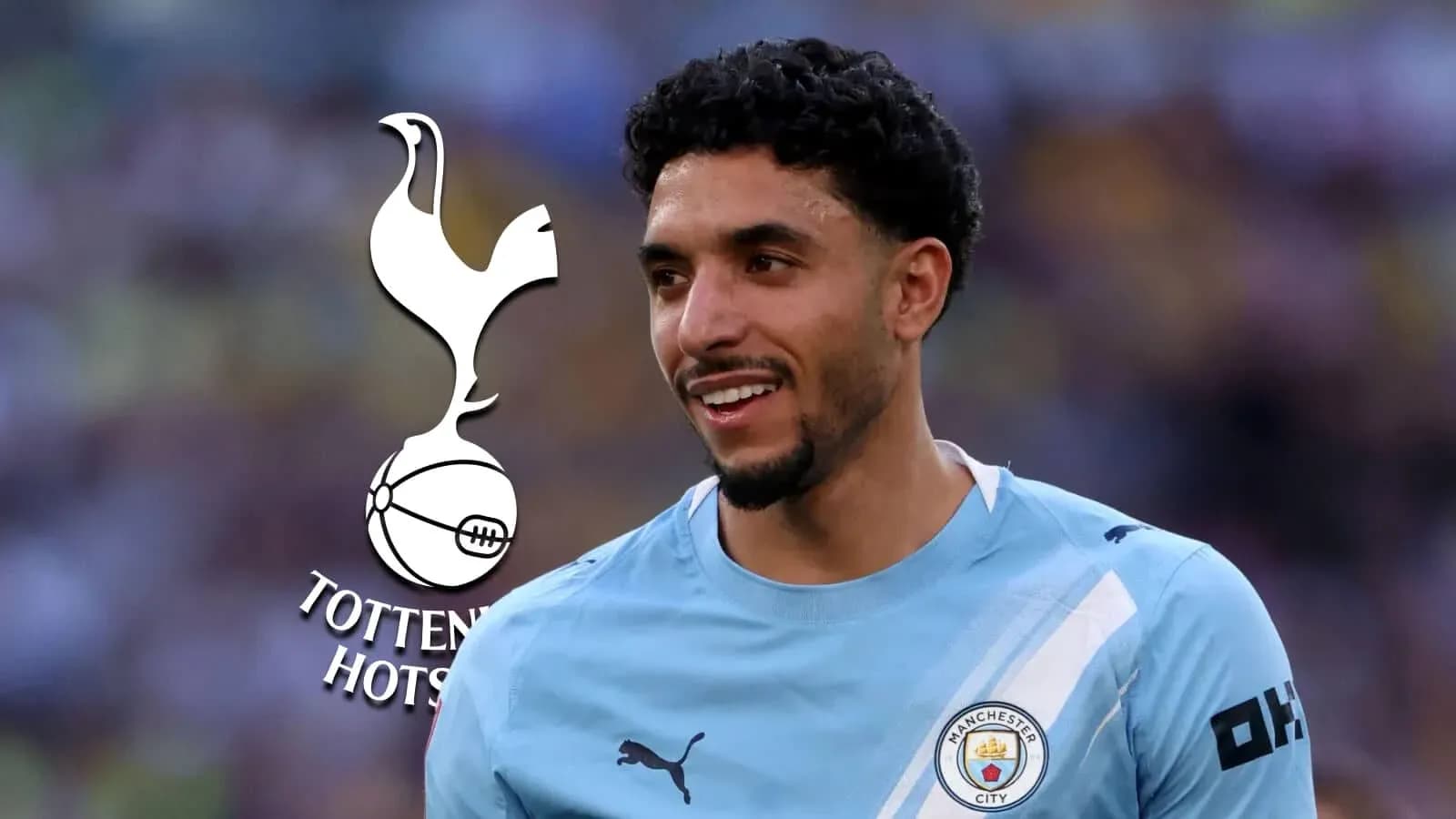 Player in Manchester City kit smiling during match