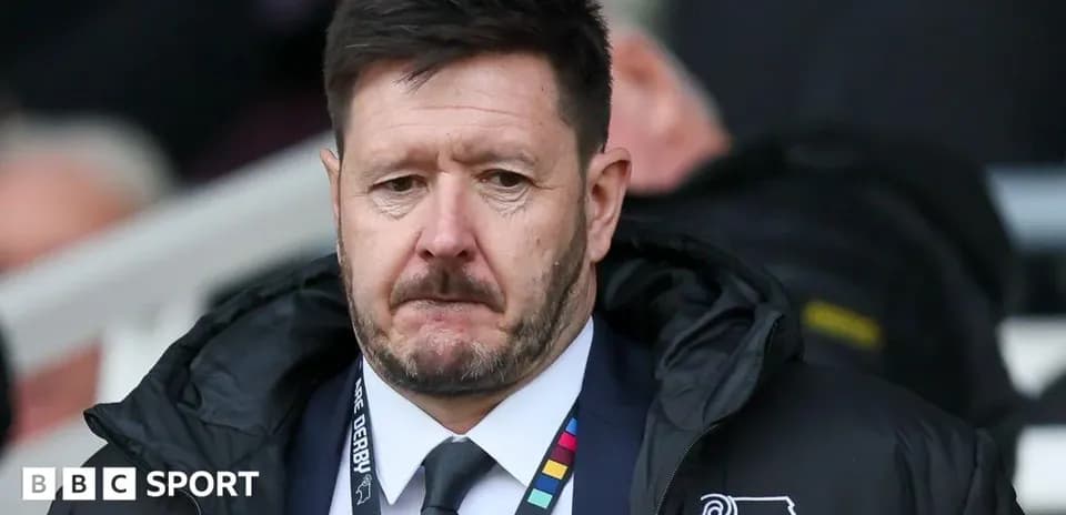 Manager wearing team jacket during match
