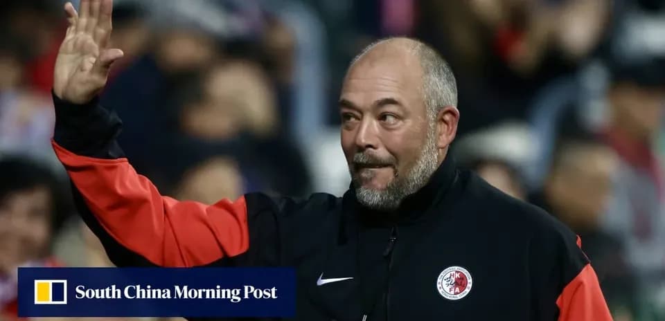 Coach waving to fans during match celebration