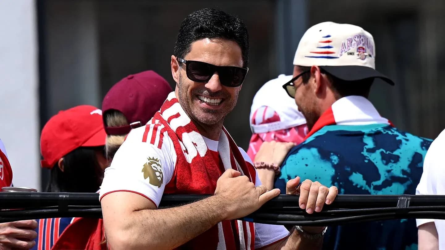 Fan wearing Arsenal scarf at event