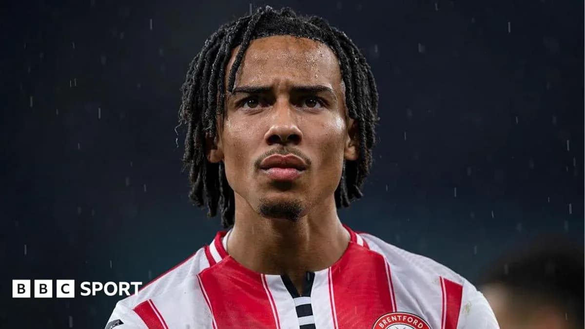Brentford player focused during rainy match