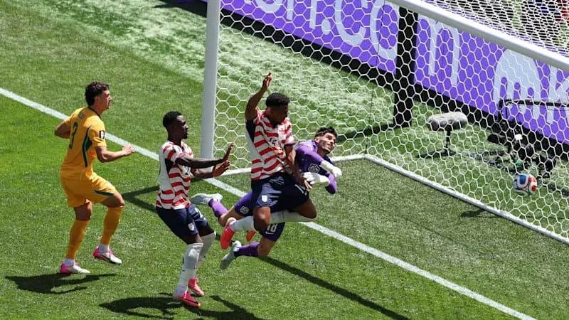 Players competing for the ball near the goal